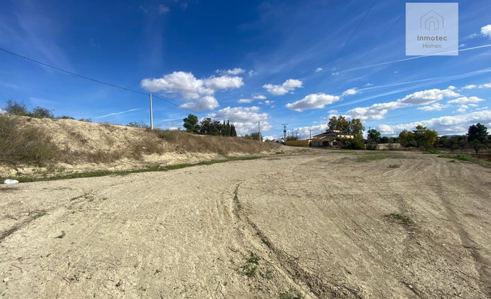 Land for construction with access road and mountain backdrop plot 1