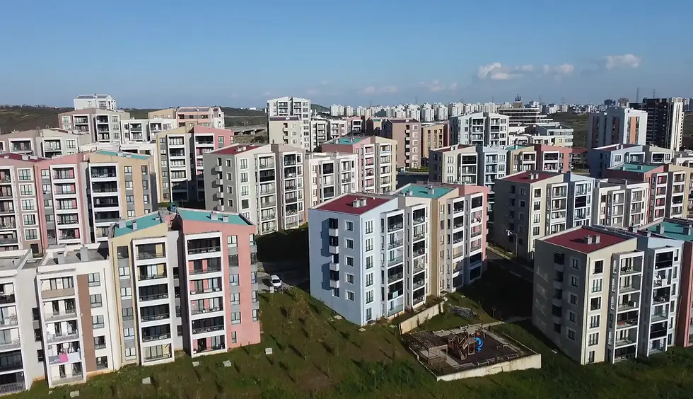 Aerial view of many colorful apartment buildings under a clear blue sky