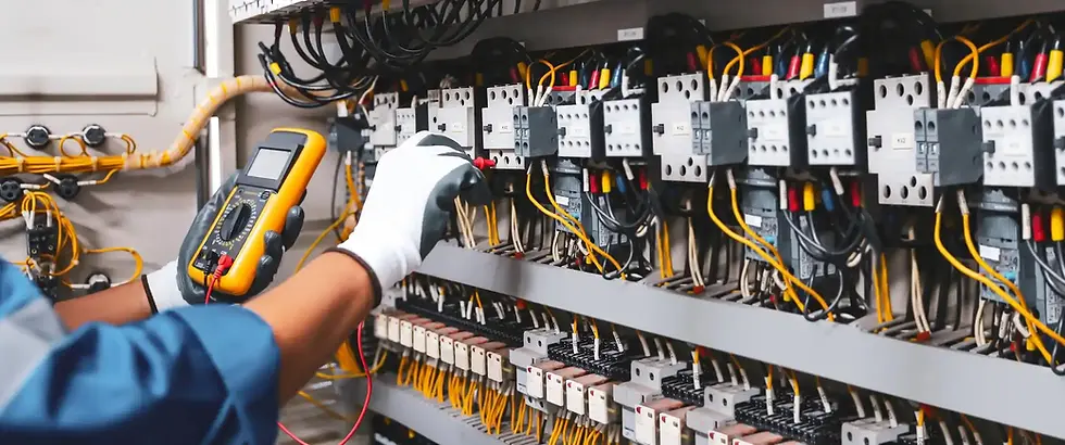 An electrician uses a multimeter to inspect complex electrical wiring system.