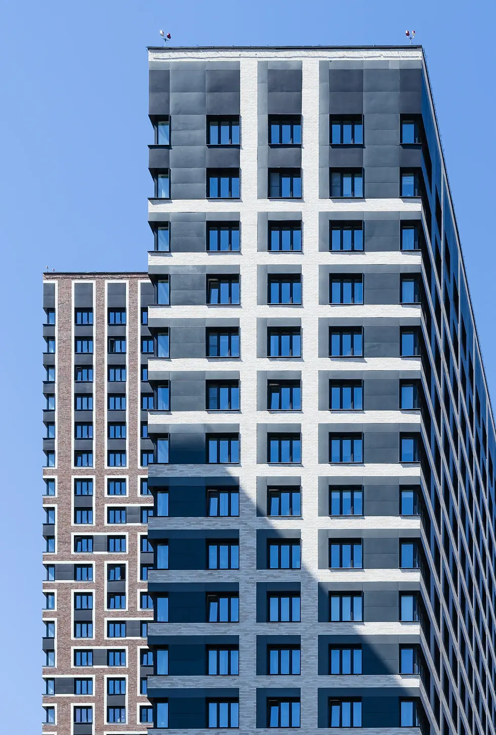 Modern residential skyscraper with white and grey facade