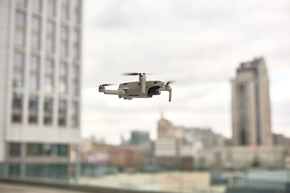 grey-drone-fly-city-center-exploring-new-building-with-innovative-technology-taking-aerial