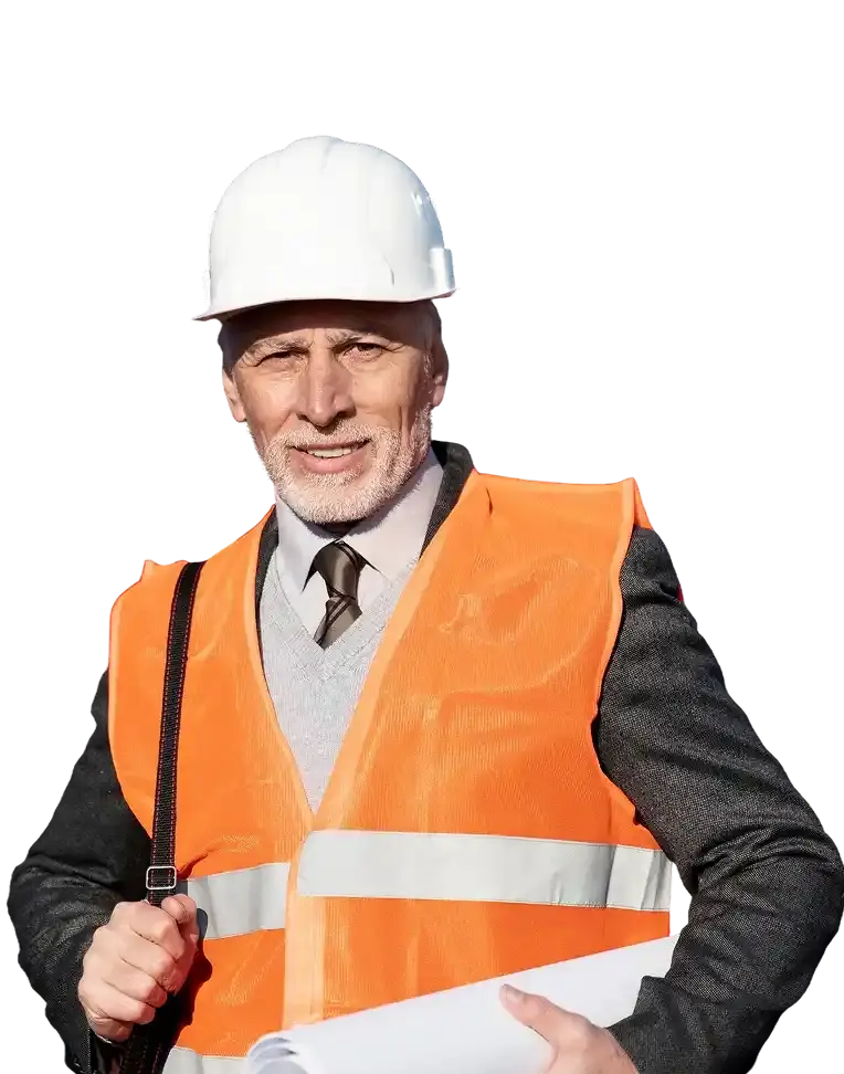 Smiling construction worker wearing a white helmet and orange safety vest holding plans.