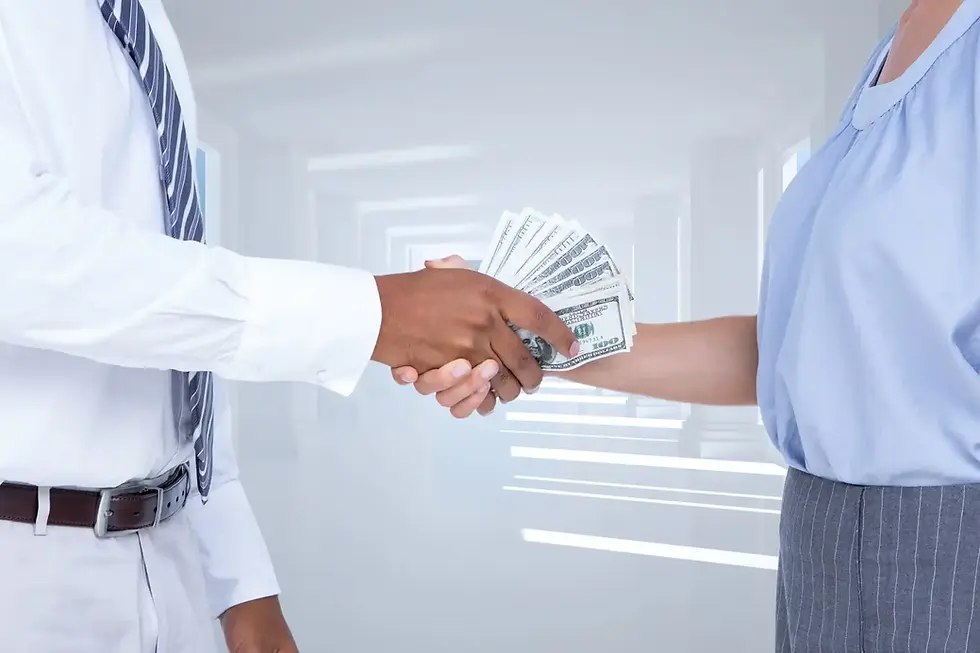 Business handshake with money exchange, partnership agreement on light background.