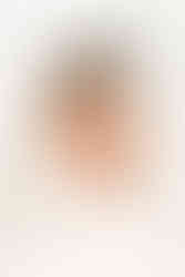 Newborn baby wrapped in a swaddle during a studio newborn photography session