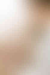 Mom and dad holding their newborn baby during an in-home newborn session in Guelph, Ontario