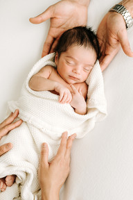 Newborn baby wrapped in a swaddle during a studio newborn photography session