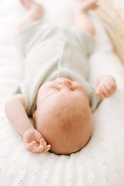 Newborn baby during a newborn session in Guelph, Ontario in a clean studio setup