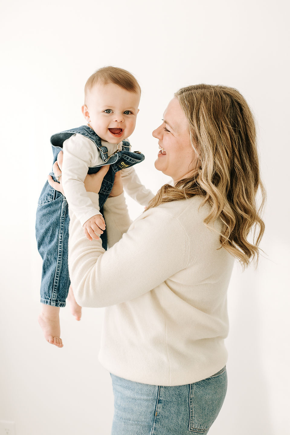 Mother and baby boy together in a first birthday family photoshoot at Guelph photography studio.