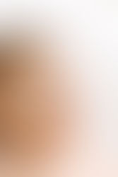 Close-up newborn session in Guelph, Ontario featuring newborn baby with blue eyes in a timeless white studio portrait