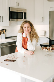 Emily from Cocoa Beau Chocolate creating handcrafted chocolates during a branding session in a home kitchen in Guelph, Ontario.