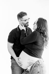 Mom and dad-to-be during a maternity session in Guelph, Ontario, capturing a quiet moment before welcoming their new baby.