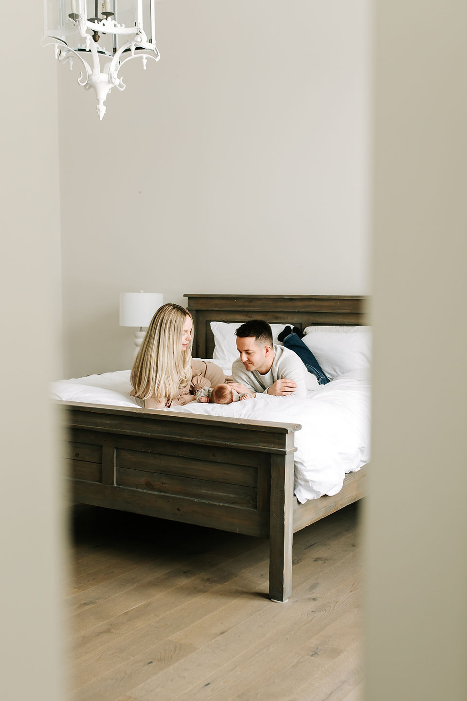 Family with newborn baby in a natural home setting during an in-home newborn session in Guelph, Ontario