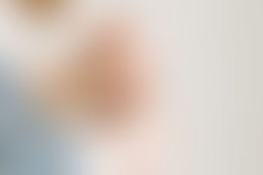 Family milestone session in Guelph, Ontario capturing a detail portrait of a baby's hand wrapped around a parent's finger
