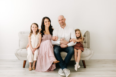 Family of five with newborn baby during a newborn session in Guelph, Ontario captured in a soft studio portrait