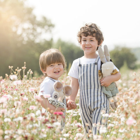 Two little boys pose with their soft toys in the confetti fields in Worcestershire