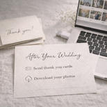 A softly lit desk showing a computer and note saying 'After Your Wedding'