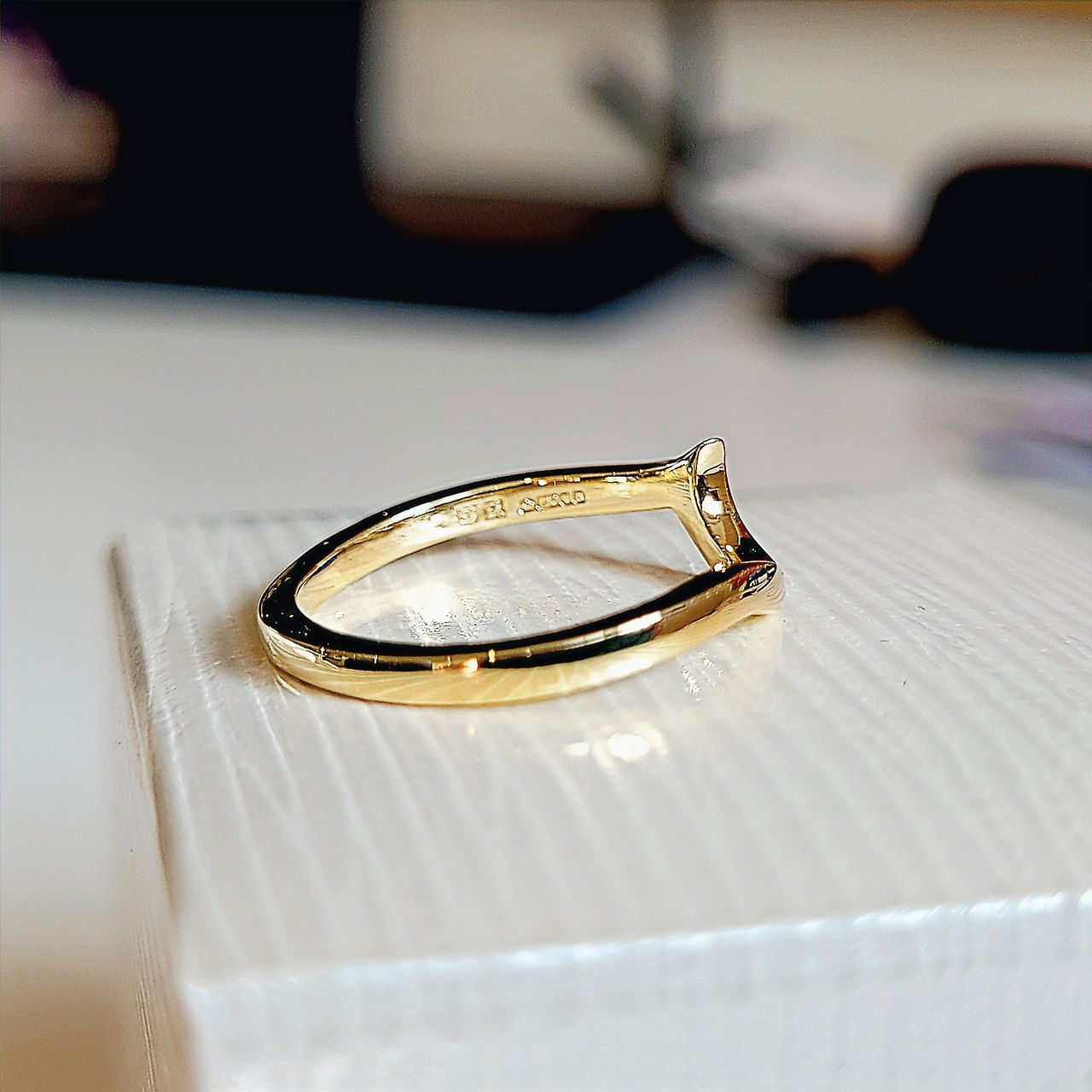 gold wedding ring designed to stack alongside heirloom engagement ring