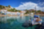 Traditional village of Evdilos, in Ikaria island, Greece, with fishing boats.jpg