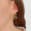 Thumbnail: Boucles d'oreilles fleur. Acier inoxydable doré