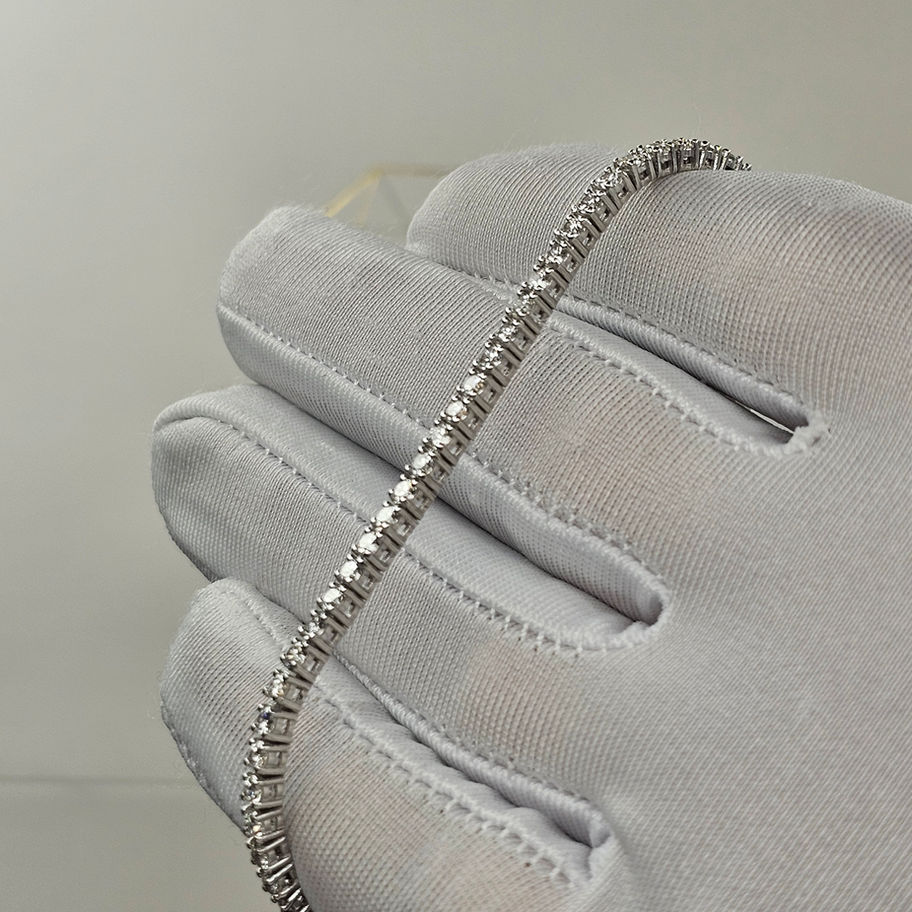 14K white gold tennis bracelet featuring 3.70-4.20 carats of lab-grown diamonds, D-F color, and VVS clarity