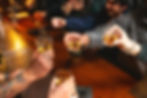 guests at the bar toasting