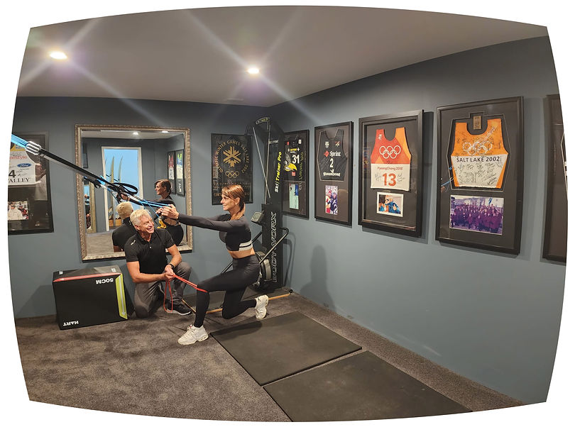 Peter Hogg discussing an exercise plan for his patient in his onsite gym.