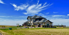 Reminiscent of Tudor Revivial, but with bright, modern interior