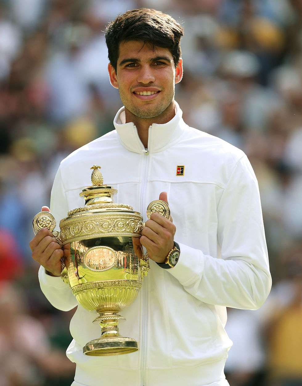 carlos-alcaraz-poses-with-the-gentlemens-single-tropy-at-wimbledon-2024.jpg