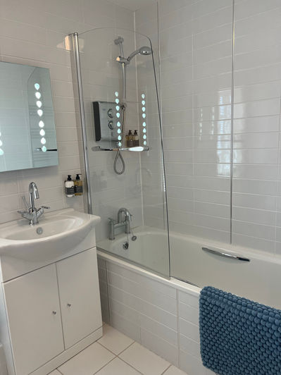 Bath with shower over