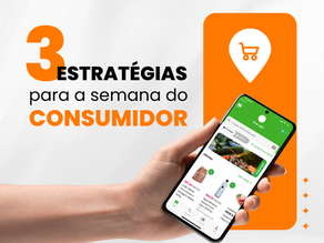 um braço segurando um celular com aplicativo para supermercado