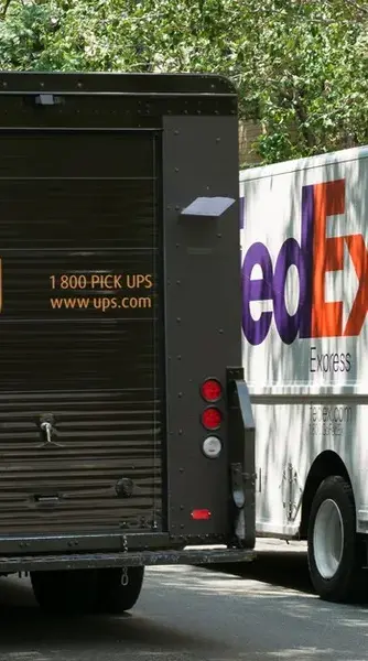 USPS and FEDEX Trucks