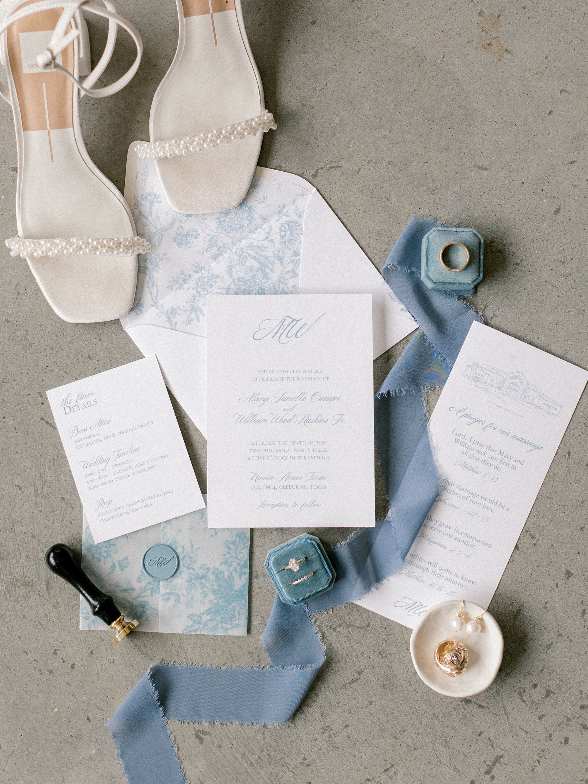 dusty blue wedding detail flat lay