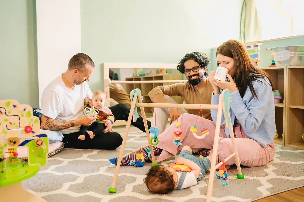 Parents playing with toddlers at Baby Bee