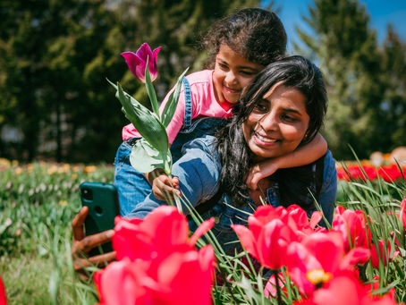 Mother and daughter visiting a tulip field