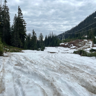 Snowy road conditions at 13km mark in may on Squamish to Indian Arm overland route