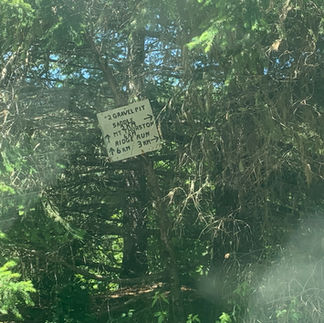 Closeup of signage at intersection enroute to Upper Bridal Falls.