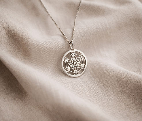 Intricate silver pendant on linen_edited.jpg