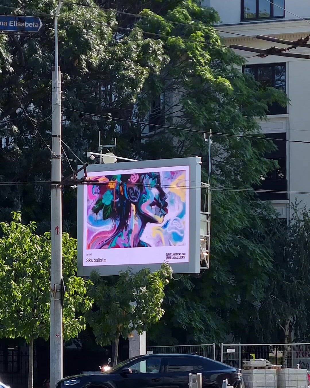 A Moment in the Sun by Skubalisto on a public screen in Bucharest