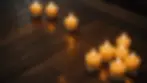 High angle view of candles on a rustic wooden table