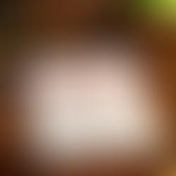 Legal document labeled "UNCONSTITUTIONAL" on a wooden desk with a gavel, scales, glasses, and a green lamp, suggesting a courtroom setting.