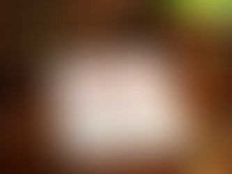 Legal document labeled "UNCONSTITUTIONAL" on a wooden desk with a gavel, scales, glasses, and a green lamp, suggesting a courtroom setting.