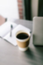 Close-up view of an open photography book with notes and sketches