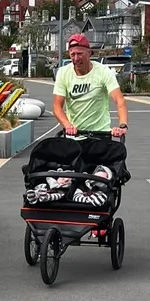 *Wrexham AAC athlete James Yarwood with his twin baby buggy.