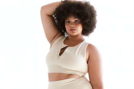Beauty image of a plus-size African model with afro hair.