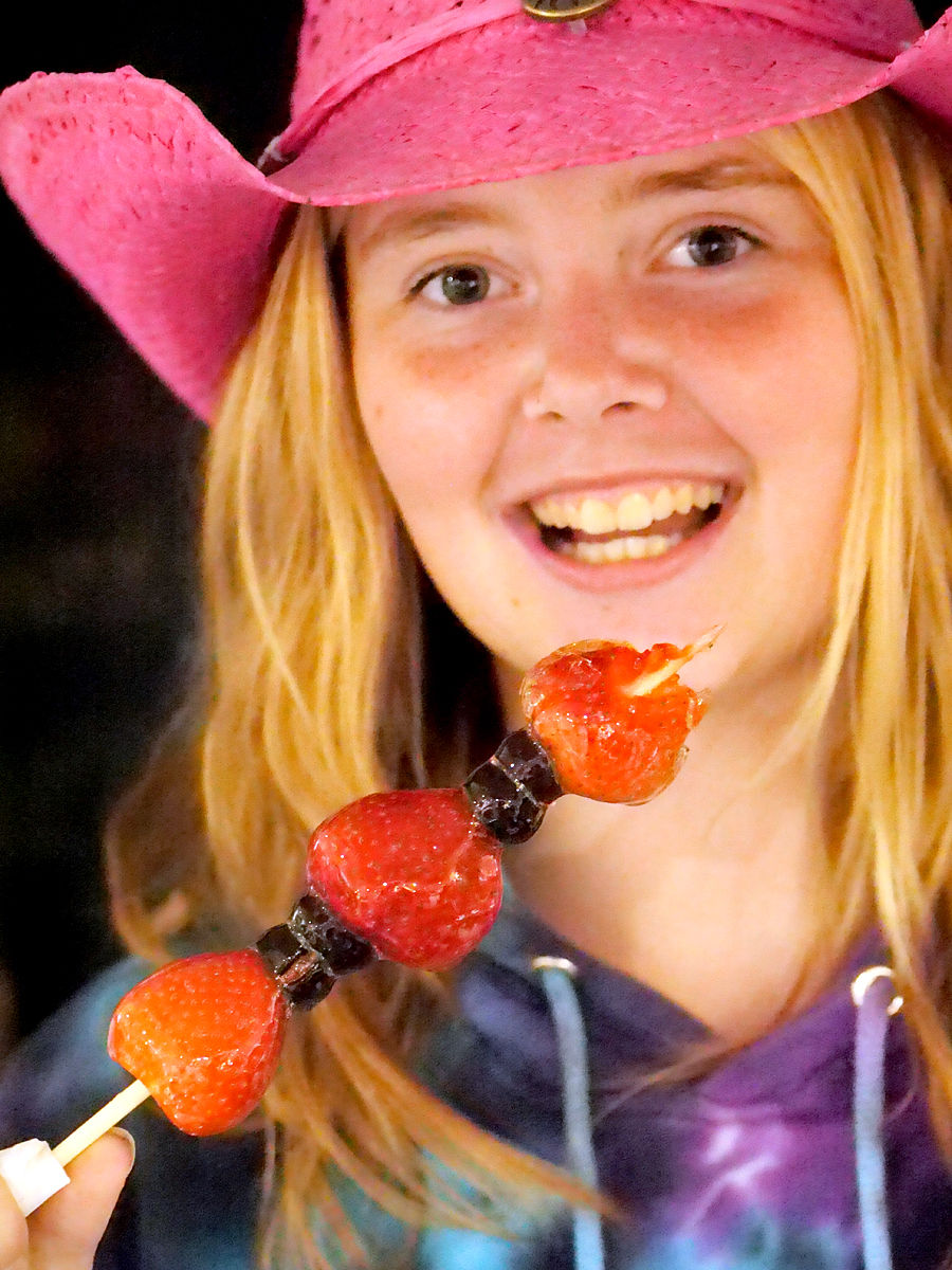 Lexi tries tanghulu at the 2024 Norfolk County Fair & Horse Show.