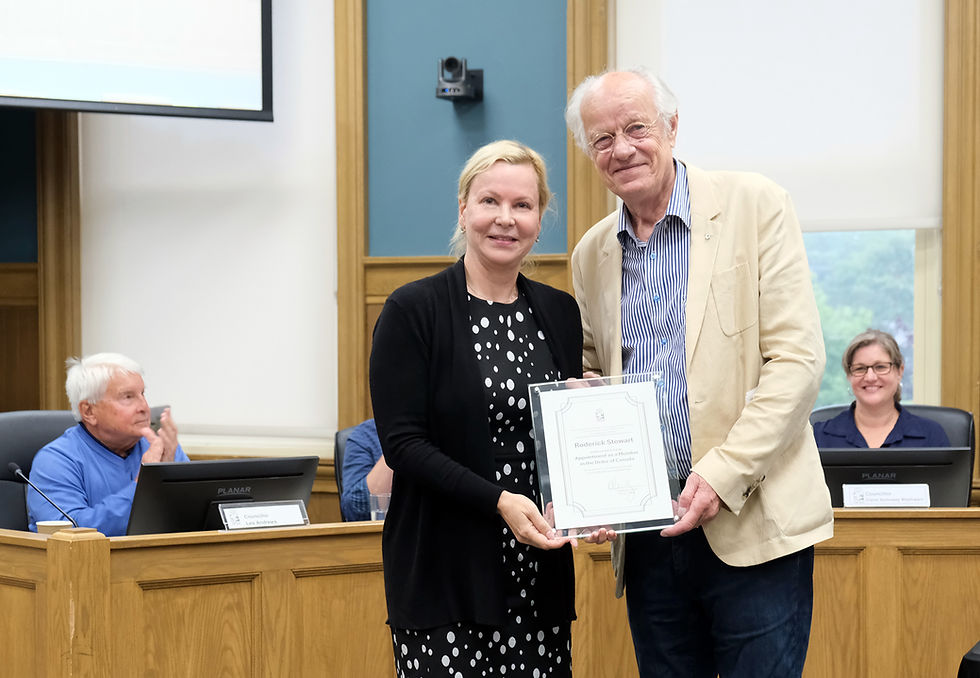 Mayor Olena Hankivsky presents Port Hope resident Rod Stewart a commemorative plaque at council’s July meeting where Stewart was honoured locally following his appointment to the Order of Canada. /Municipality of Port Hope photo