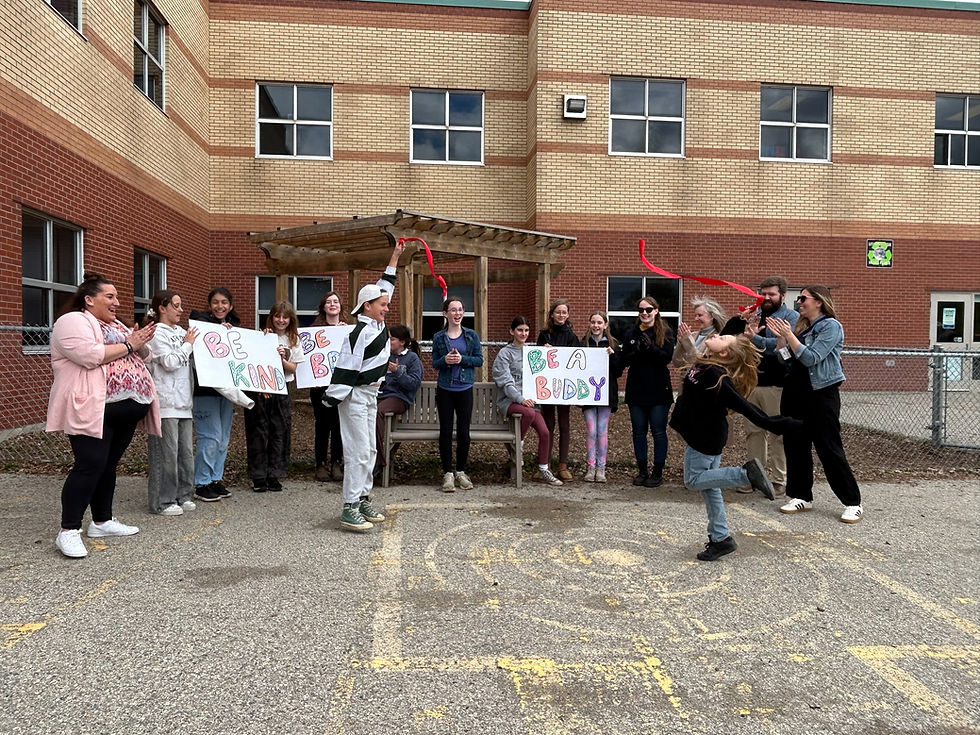 Anne Hathaway Public School student council members cut the ribbon on Thursday, May 14, officially unveiling the new Buddy Bench on the school playground.