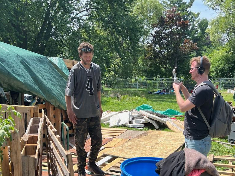 A scene from HOME captures filming inside the Cobourg encampment at the centre of Linda Schuyler and Will Bowes’ new documentary. The film shares first-person stories of people living unhoused while exploring the complex circumstances surrounding homelessness, addiction and displacement.