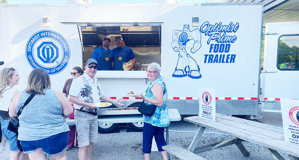 Al and Ellen Fuhr, both recipients of the Shakespeare Community Athletic Association's Honorary Service Award, wait for an order of fresh-cut fries during the annual Shakespeare Field Day fish fry. Serving customers from the Tavistock Optimist Club fry wagon are Jeff Stoesser, left, and Jesse Weicker. Gary West photo