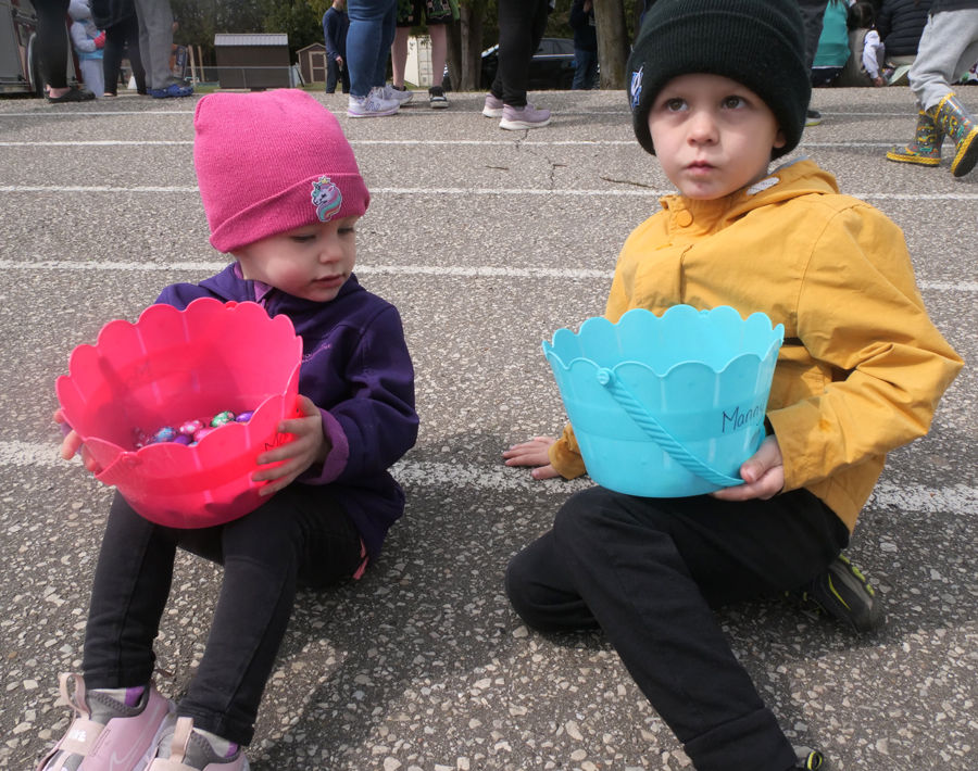 Macy and Manny Chesterman of Langton wait for the draw prizes to be announced Friday at the Langton Easter Egg Hunt.
